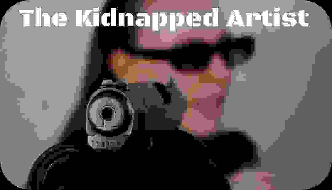 An artist is pointed by a gun 