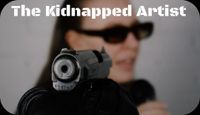 An artist is pointed by a gun 